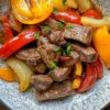 Delicious Pepper Steak with Vibrant Bell Peppers and Savory Onion